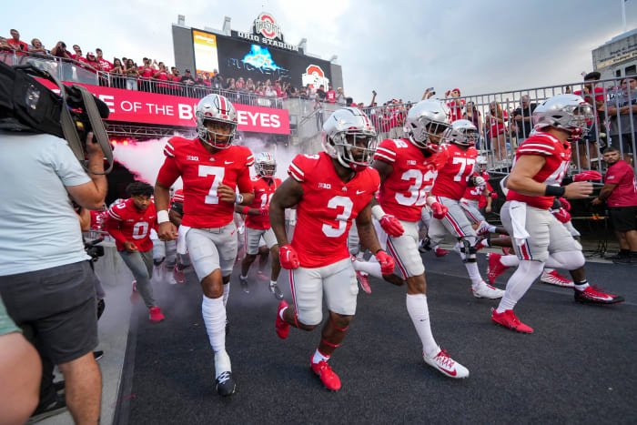 Ohio State players run out of the tunnel ahead of their game versus Toledo